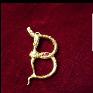 Erté 14 K gold pendant with ruby and diamond